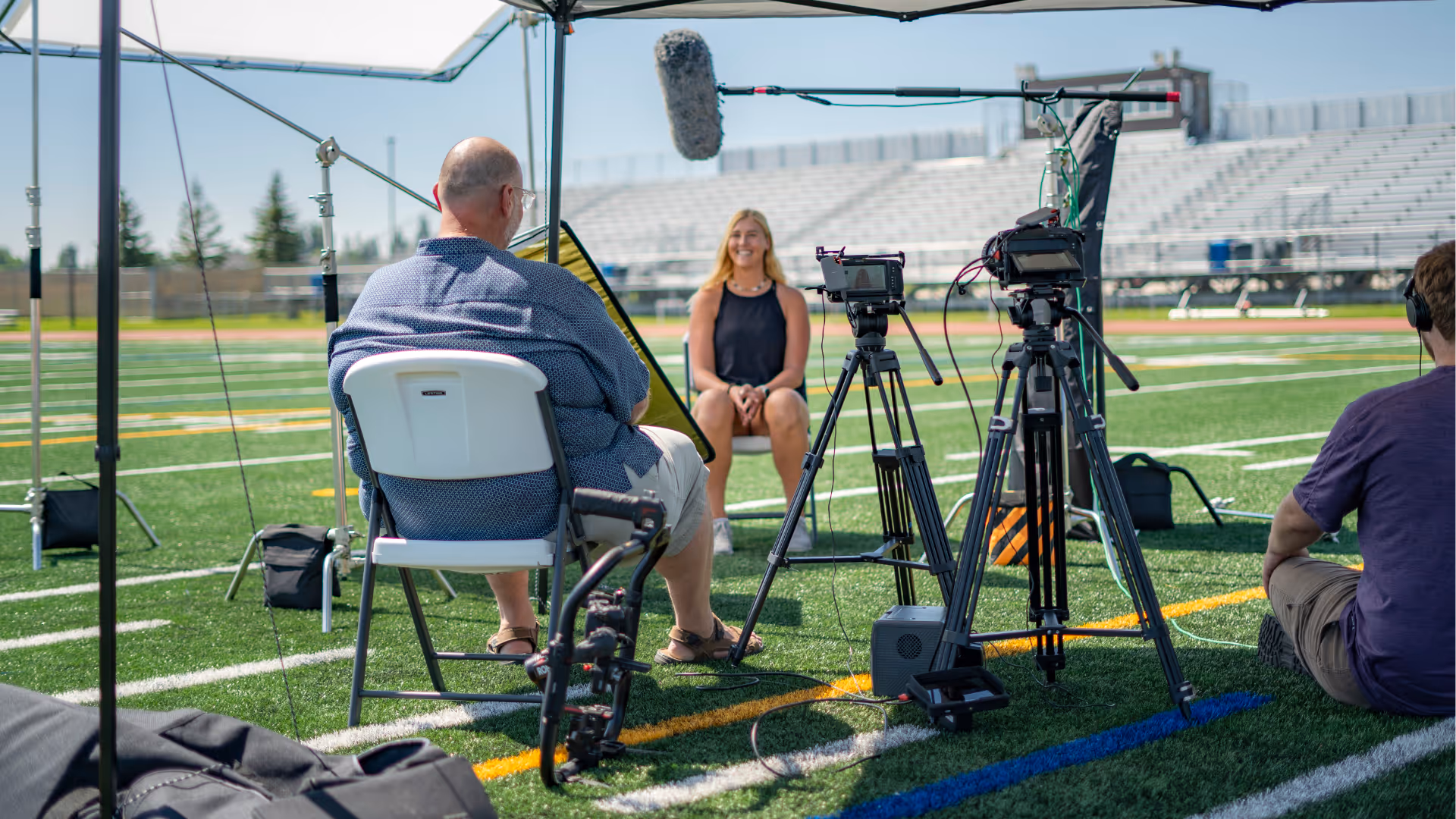 Documentary film crew filming an interview