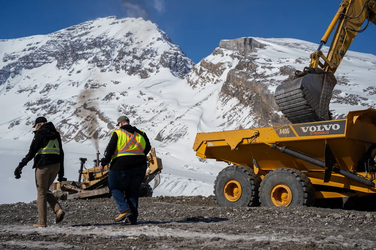 Crew filming on a mountain job site